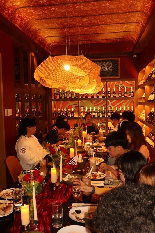 Friends celebrating at a long table